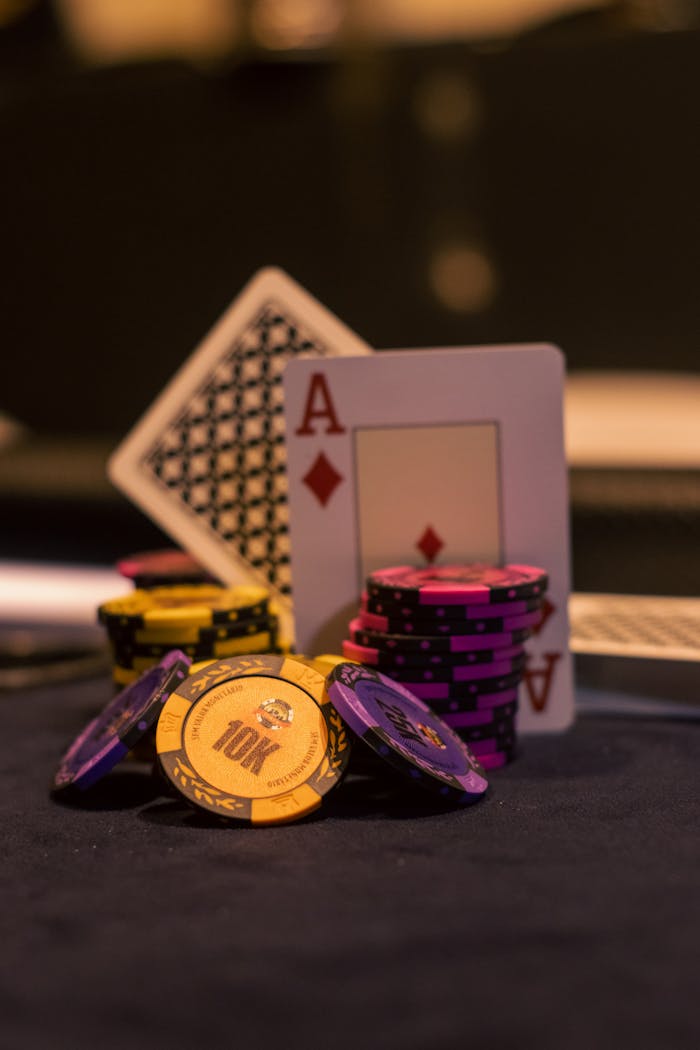 hero-img-02 Close-up of poker chips and playing cards on a casino table, great for gambling themes.